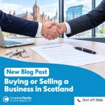 Buyer and seller shaking hands over a signed business sale agreement in a Glasgow office