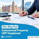 Solicitor reviewing a commercial property LBTT return in Scotland, with property keys and calculator on the desk